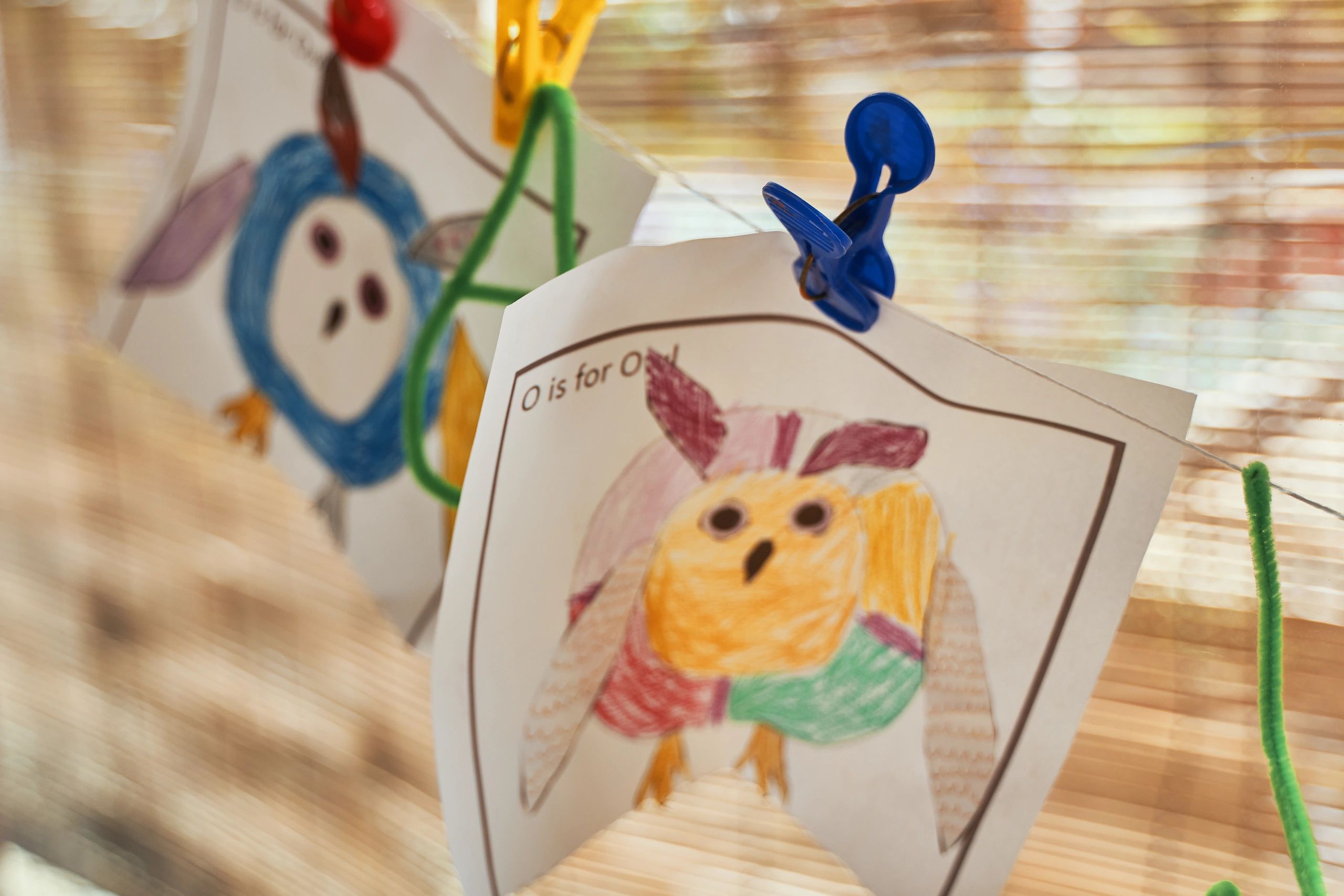 Child artwork hanging on a wall