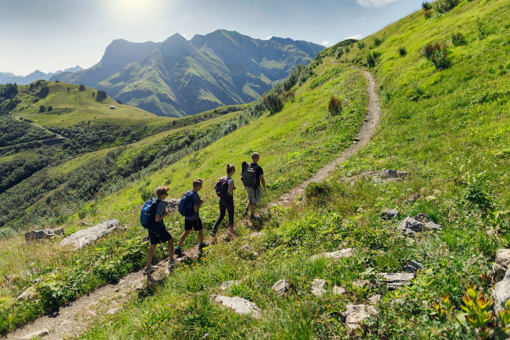 Family hiking together on a mountain trail