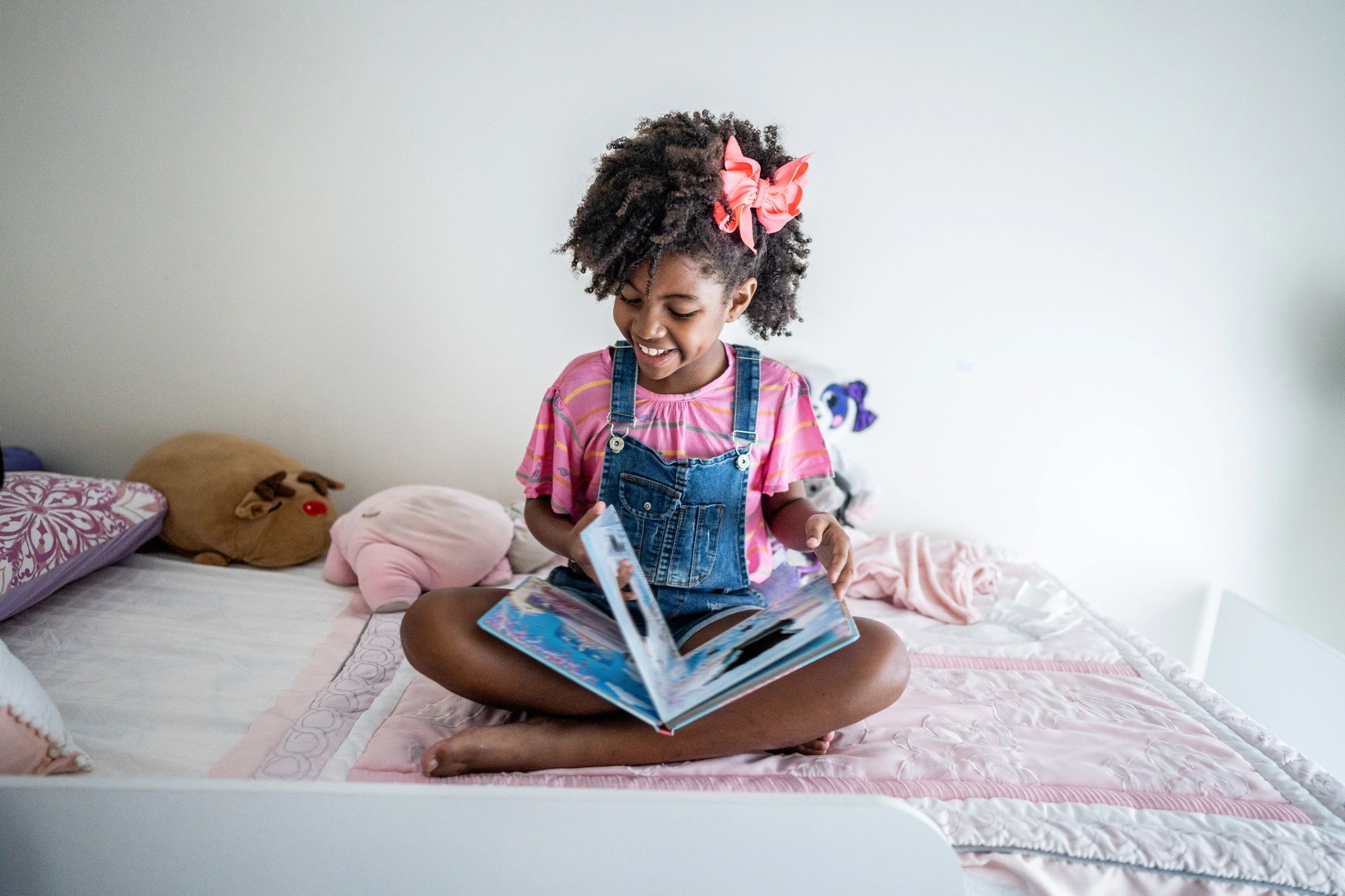 Child reading quietly in a bedroom