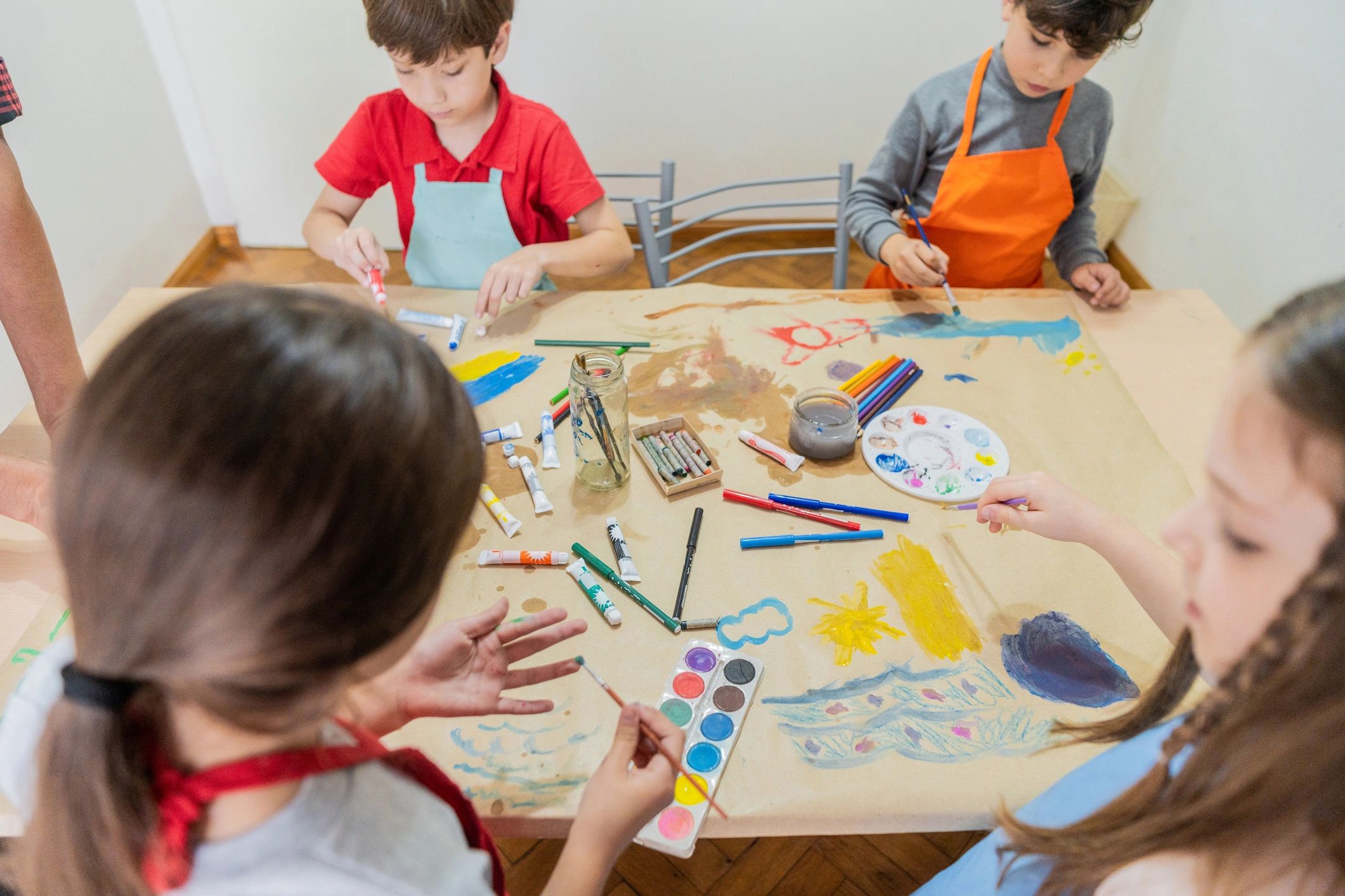 Children painting together during an art activity