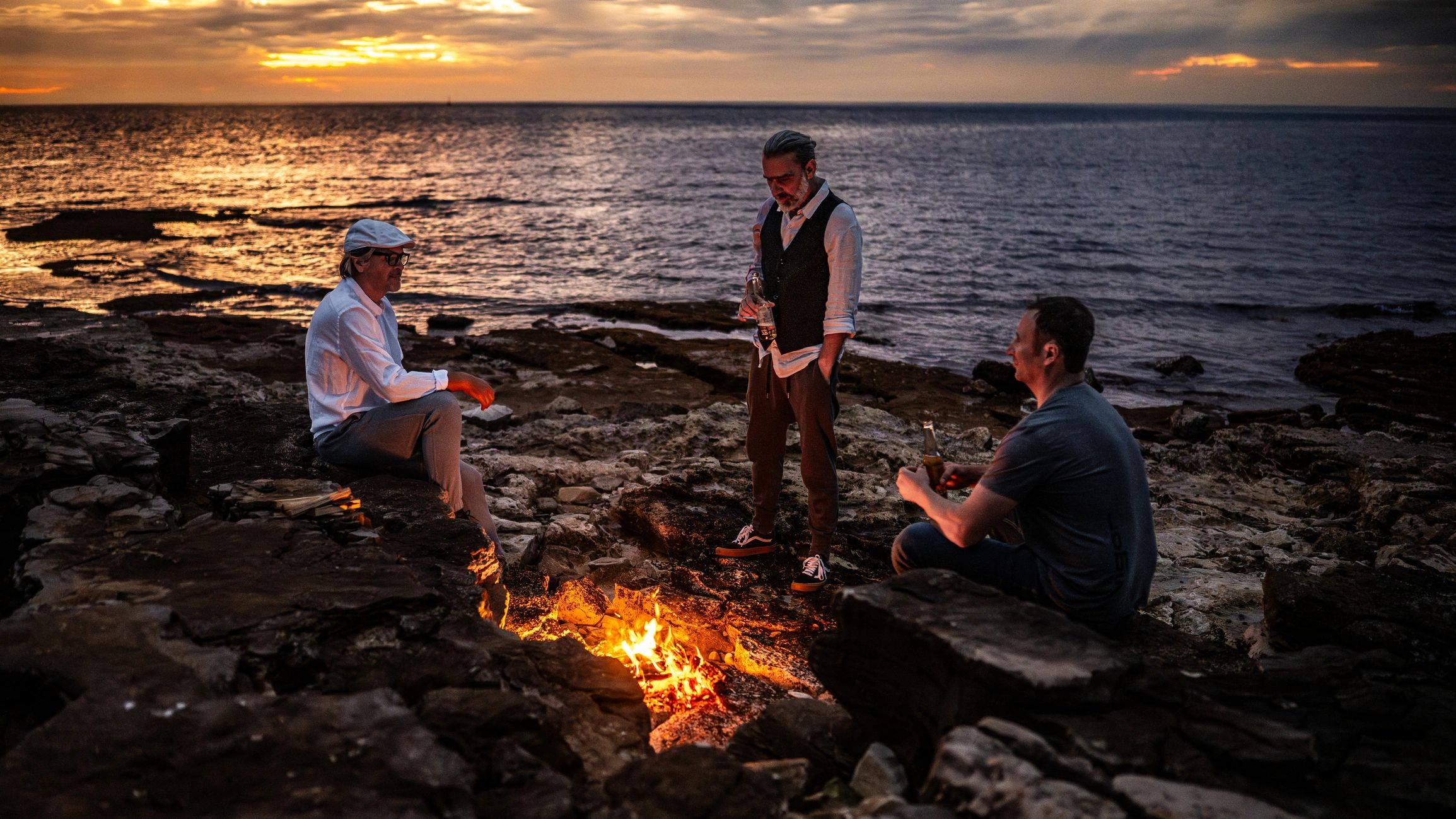 Campfire at sunset during a camping trip